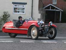 Morgan three-wheeler arriving at Stoke Lacy Church